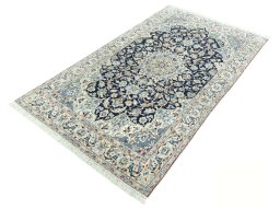 Corner detail of 2000s Nain rug showing border pattern and Wool pile