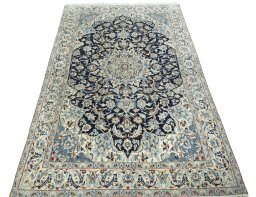 Surface texture of 2000s Nain rug with natural Wool and intricate pattern