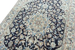 Backside of handmade 2000s Nain rug showing knot structure and weave density
