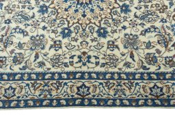 Corner detail of 2000s Nain rug showing border pattern and Wool pile