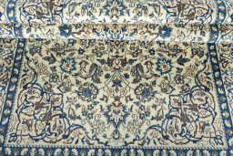 Close-up detail of 2000s Nain rug from Iran / Persia showing Wool weave