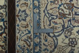 Backside of handmade 2000s Nain rug showing knot structure and weave density