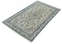 Corner detail of 2000s Nain rug showing border pattern and Wool pile