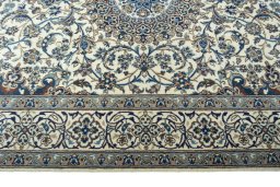 Corner detail of 2000s Nain rug showing border pattern and Wool pile