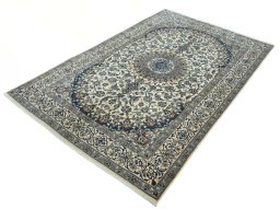 Corner detail of 2000s Nain rug showing border pattern and Wool pile