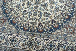 Close-up detail of 2000s Nain rug from Iran / Persia showing Wool weave