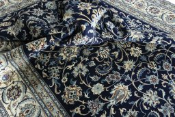 Surface texture of 2000s Nain rug with natural Wool and intricate pattern
