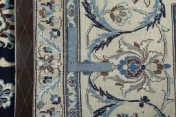 Backside of handmade 2000s Nain rug showing knot structure and weave density
