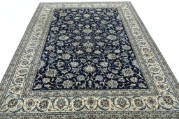 Surface texture of 2000s Nain rug with natural Wool and intricate pattern