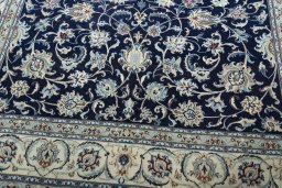 Close-up detail of 2000s Nain rug from Iran / Persia showing Wool weave