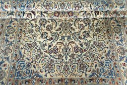 Corner detail of 2000s Nain rug showing border pattern and Wool pile