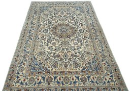 Surface texture of 2000s Nain rug with natural Wool and intricate pattern