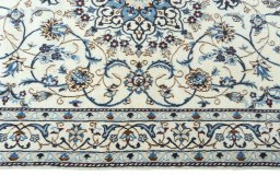 Corner detail of 2000s Nain rug showing border pattern and Wool pile