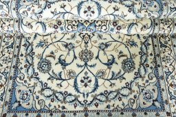 Close-up detail of 2000s Nain rug from Iran / Persia showing Wool weave