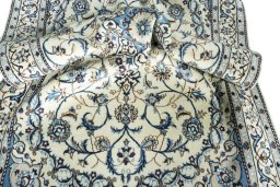 Surface texture of 2000s Nain rug with natural Wool and intricate pattern