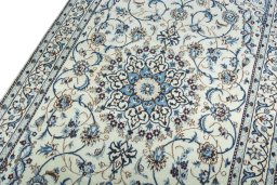 Backside of handmade 2000s Nain rug showing knot structure and weave density