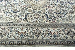 Corner detail of 2000s Nain rug showing border pattern and Wool pile