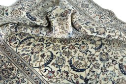 Surface texture of 2000s Nain rug with natural Wool and intricate pattern