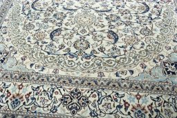 Close-up detail of 2000s Nain rug from Iran / Persia showing Wool weave