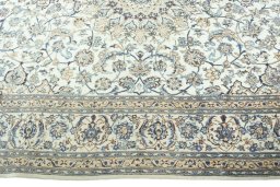 Corner detail of 2000s Nain rug showing border pattern and Wool pile