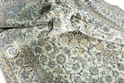 Surface texture of 2000s Nain rug with natural Wool and intricate pattern
