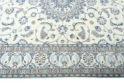 Corner detail of 2000s Nain rug showing border pattern and Wool pile