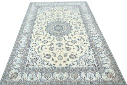 Surface texture of 2000s Nain rug with natural Wool and intricate pattern