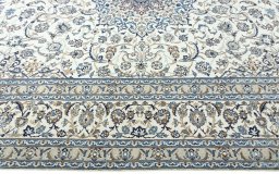 Corner detail of 2000s Nain rug showing border pattern and Wool pile
