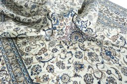 Surface texture of 2000s Nain rug with natural Wool and intricate pattern