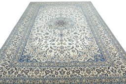 Surface texture of 2000s Nain rug with natural Wool and intricate pattern