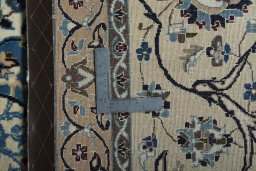 Backside of handmade 2000s Nain rug showing knot structure and weave density