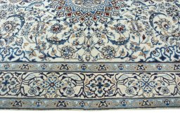 Corner detail of 2000s Nain rug showing border pattern and Wool pile