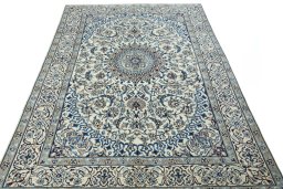 Surface texture of 2000s Nain rug with natural Wool and intricate pattern