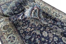 Surface texture of 2000s Nain rug with natural Wool and intricate pattern