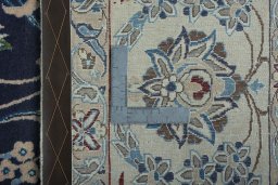 Backside of handmade 2000s Nain rug showing knot structure and weave density