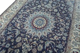 Backside of handmade 2000s Nain rug showing knot structure and weave density