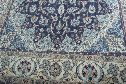 Close-up detail of 2000s Nain rug from Iran / Persia showing Wool weave