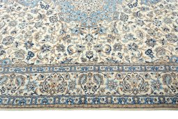 Corner detail of 2000s Nain rug showing border pattern and Wool pile