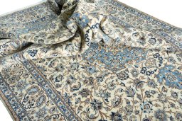 Surface texture of 2000s Nain rug with natural Wool and intricate pattern