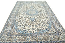 Surface texture of 2000s Nain rug with natural Wool and intricate pattern