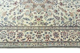 Corner detail of 2000s Nain rug showing border pattern and Wool pile