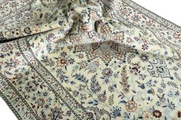 Surface texture of 2000s Nain rug with natural Wool and intricate pattern