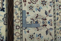 Backside of handmade 2000s Nain rug showing knot structure and weave density