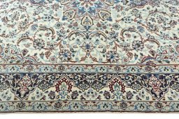 Corner detail of 2000s Nain rug showing border pattern and Wool pile