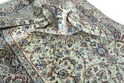 Surface texture of 2000s Nain rug with natural Wool and intricate pattern