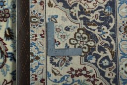 Backside of handmade 2000s Nain rug showing knot structure and weave density