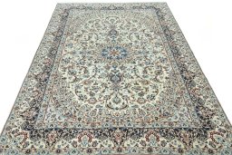 Surface texture of 2000s Nain rug with natural Wool and intricate pattern