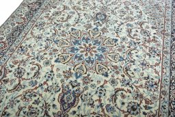 Backside of handmade 2000s Nain rug showing knot structure and weave density