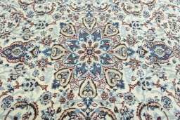 Central medallion detail of 2000s Nain rug from Iran / Persia