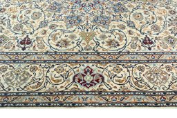 Corner detail of 2000s Nain rug showing border pattern and Wool pile